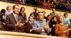 Nixon and Chinese Premier Zhou Enlai view a gymnastics demonstration.